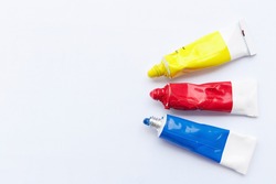 Three primary colors on white background.Red, blue and yellow color tubes.
