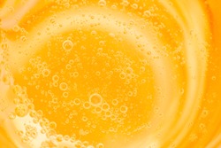 Bubbles on beer background.Yellow circle and liquid pattern.