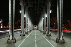 Landscape shot in color with car lights trails under the Bir-Hakeim Bridge in Paris