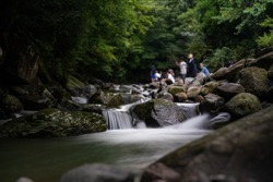 Mountain stream fishing in Kamitsue Village, Hita City, Oita Prefecture.Shoot the water flowing through the waterfall with a slow shutter