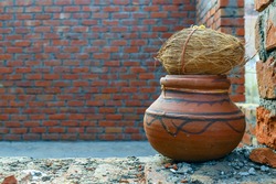 coconut on clay urn religious tradition of hindus on building new home