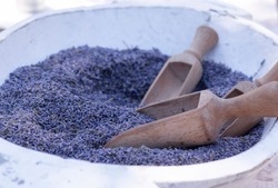 A bowl of natural dried fragrant purple lavender flower after harvest, mediterranean and floral scent, relaxing and calming, aromatherapy concept