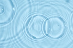 Blue water texture, blue water surface with rings and ripples. Spa concept background. Flat lay