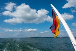 Stern of the passenger ship with the German flag on Lake Constance