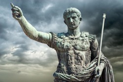 Rome, Italy, Bronze statue of Emperor Augustus (Gaius Iulius Cæsar Octavianus Augustus) on a stormy sky background.