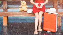 beautiful young asian Pregnant woman traveling alone at train station, vintage tone 