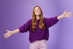 Come into my arms, girl wants give warm hug. Portrait of friendly and cute charming redhead woman stretching hands across copy space and looking forward with happy smile to cuddle and welcome guests