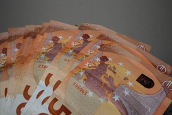 Big heap of 50 euros bilBig heap of 50 euros bills spreaded over a table. High quality photo