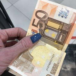 Macro photo 50 euro currency bill. Stock photo euro money in hand