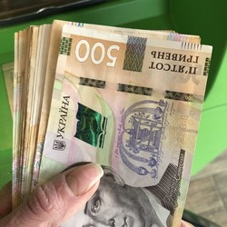 Macro photo 500 Ukrainian hryvnia money. Stock photo Ukrainian currency money in hand