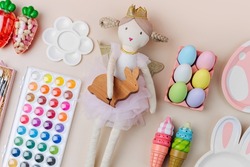 Ideas for kids Easter Basket gifts. Ragdoll, Easter eggs, sweets and material for creativity and art activity. Holidays decorations and gifts.