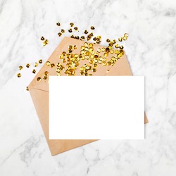 Empty card with envelope and gold confetti. Mockup template. View from above