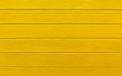 Colorful wooden boards painted in yellow. Yellow wood background.