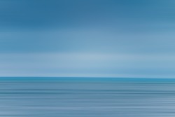 seascape abstract with panning motion combined with a long exposure. Image displays soft, pastel colors in a retro style.