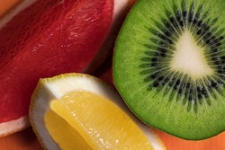 Slices of fresh  kiwi,lemon and grapefruit.Fruit background.Macro food photography.