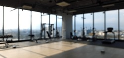 Blur focus of equipment interior gym and modern fitness room center.