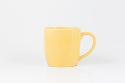yellow coffee cup on a white background,Yellow tea cup isolated on white.