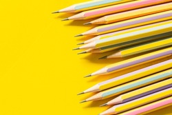 wooden pencil on yellow background,Colorful pencils at border of banner yellow background