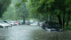 Flooded cars on the street of the city. Street after heavy rain. Water could enter the engine, transmission parts or other places. Disaster Motor Vehicle Insurance Claim Themed. Severe weather concept