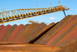 stock piles of iron ore at port.