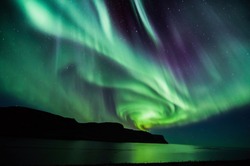 Icelandic spiral northern lights in autumn time