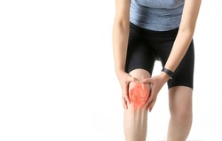 Woman in sportswear is holding painful knee joint (x-ray bone)