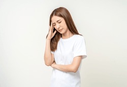 Young asian beautiful woman hand touching head she's feeling depressed stress headache be tired from working standing on isolated white background she has symptom office syndrome.