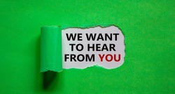 The words 'we want to hear from you' appearing behind torn green paper. Beautiful background. Business concept.
