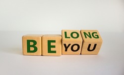 Be you, belong symbol. Turned cubes and changed words 'be you' to 'belong'. Beautiful white background. Business, belonging and be you, belong concept. Copy space.