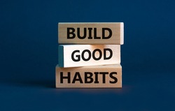 Build good habits symbol. Wooden blocks with words 'build good habits'. Beautiful grey background, copy space. Business, psychological and build good habits concept.