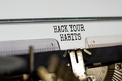 Hack your habits symbol. Words 'Hack your habits' typed on retro typewriter. Business, psychology and hack your habits concept. Copy space.