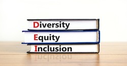DEI, Diversity, equity, inclusion symbol. Books with words DEI, diversity, equity, inclusion on beautiful wooden table, white background. Business, DEI, diversity, equity, inclusion concept.