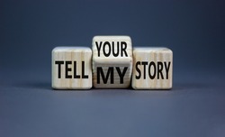 Tell my or your story. Turned wooden cubes and changed words tell my story to tell your story. Beautiful grey background, copy space. Business, storytelling and my or your story concept.