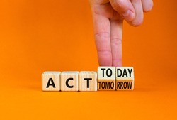 Act today not tomorrow symbol. Businessman turns wooden cubes, changes words act tomorrow to act today. Beautiful orange table, orange background. Business, act today or tomorrow concept, copy space.