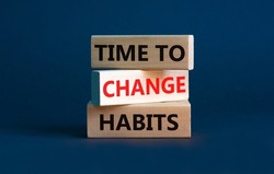 Time to change habits symbol. Concept words 'time to change habits' on wooden blocks. Beautiful grey background. Copy space. Business and time to change habits concept.