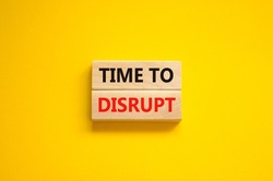 Time to disrupt symbol. Concept words Time to disrupt on wooden blocks on a beautiful yellow background. Business and time to disrupt concept. Copy space.