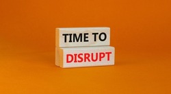 Time to disrupt symbol. Concept words Time to disrupt on wooden blocks on a beautiful orange background. Business and time to disrupt concept. Copy space.