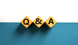 Q and A, questions and answers symbol. Concept words Q and A questions and answers on wooden cubes on a beautiful white background. Business and Q and A questions and answers concept.