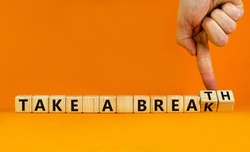 Take a break and breath symbol. Doctor turns cubes, changes words Take a break to Take a breath. Beautiful orange background, copy space. Medical, lifestyle and take a break and breath concept.