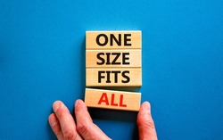 One size fits all symbol. Concept words One size fits all on wooden blocks. Businessman hand. Beautiful blue table blue background. One size fits all business concept. Copy space.