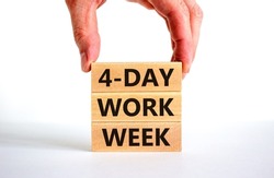 4-day work week symbol. Concept words 4-day work week on wooden blocks on beautiful white table white background. Businessman hand. Copy space. Business and 4-day work week and short workweek concept.