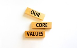 Our core values symbol. Concept words Our core values on wooden blocks on a beautiful white table white background. Business value and our core values concept. Copy space.