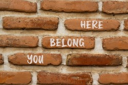 You belong here and support symbol. Concept words You belong here on brick wall. Beautiful brick wall background. Psychological business and you belong here concept. Copy space.