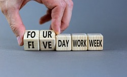 4 or 5 day work week symbol. Businessman turns cubes, changes words 'five day work week' to 'four day work week'. Beautiful grey background. Copy space. Business and 4 or 5 day work week concept.