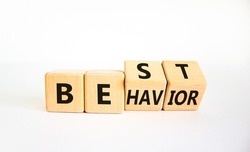 Time to best behavior symbol. Turned wooden cubes with words 'best behavior'. Beautiful white table, white background, copy space. Psychology, healthy lifestyle and best behavior concept.