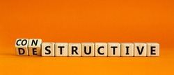 Destructive or constructive symbol. Turned wooden cubes and changed the concept word Destructive to Constructive. Beautiful grey background. Business constructive or destructive concept. Copy space.