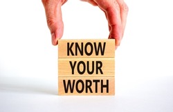 Know your worth symbol. Concept words Know your worth on wooden blocks. Businessman hand. Beautiful white table white background. Business and know your worth concept. Copy space.
