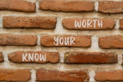 Know your worth and support symbol. Concept words Know your worth on brick wall. Beautiful brick wall background. Business and support know your worth quote concept. Copy space.
