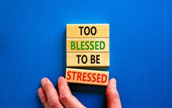 Too blessed to be stressed symbol. Concept words Too blessed to be stressed on wooden blocks. Beautiful blue table blue background. Psychological and too blessed to be stressed concept. Copy space.