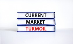 Current market turmoil symbol. Concept words Current market turmoil on books on a beautiful white table white background. Business, finacial current market turmoil concept.